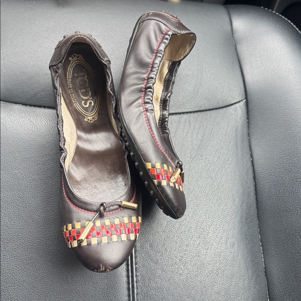 Tod’s authentic Stylish Black Flats with Red and Yellow Accents shoes